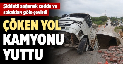 AŞIRI YAĞIŞTAN ÇÖKEN YOLA KAMYON DÜŞTÜ  