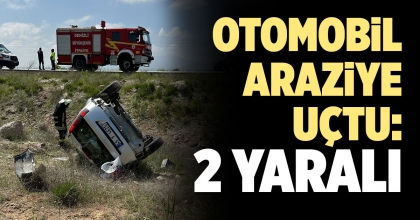 KONTROLDEN ÇIKAN OTOMOBİL BOŞ ARAZİYE UÇTU: 2 YARALI  