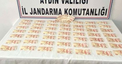BİNLERCE LİRA SAHTE PARA İLE YAKALANDI