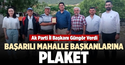 BAŞARILI MAHALLE BAŞKANLARINA PLAKET