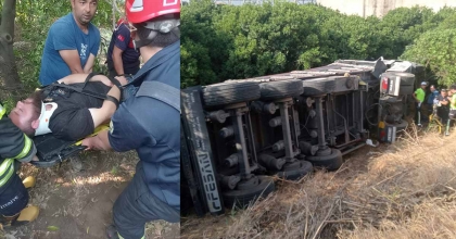 KARŞI ŞERİDE GEÇEN TIR, BAHÇEYE DEVRİLDİ