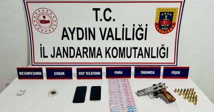 KUŞADASI’NDA RUHSATSIZ TABANCA VE UYUŞTURUCU ELE GEÇİRİLDİ