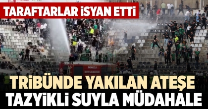 TRİBÜNDE YAKILAN ATEŞE TAZYİKLİ SUYLA MÜDAHALE