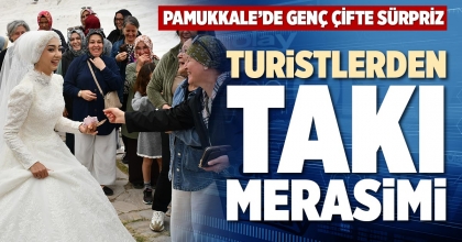 TURİSTLERDEN TAKI MERASİMİ